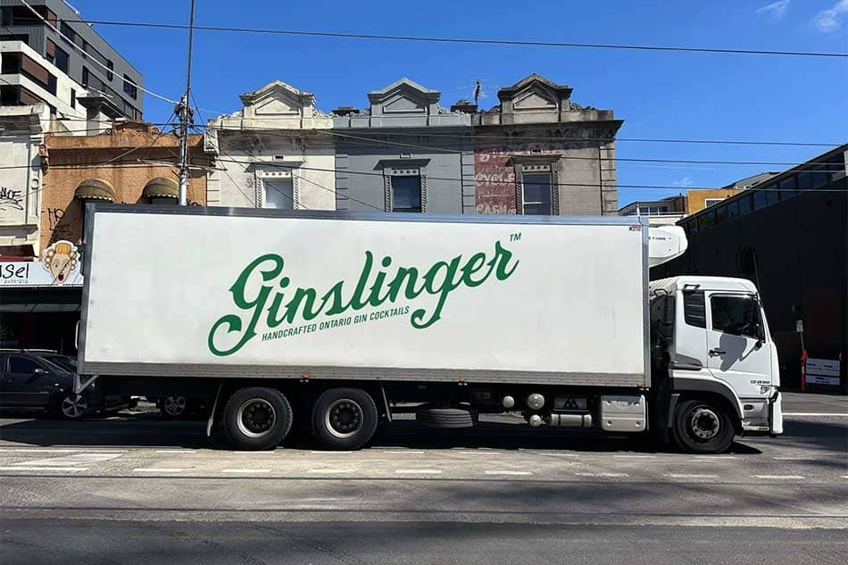 Ginslinger gin logo on a delivery truck.
