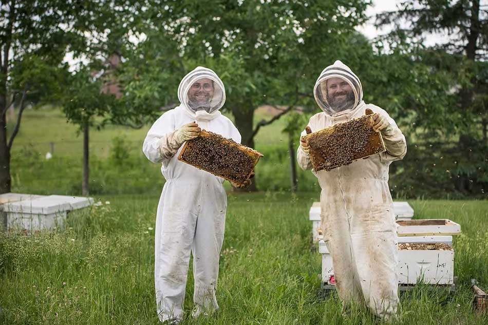 Bee keepers at the Miellerie King Distillery.
