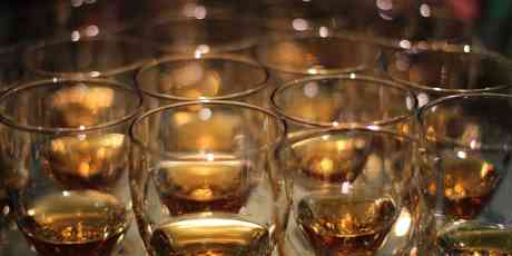 Glasses filled with whisky for a whisky tasting.