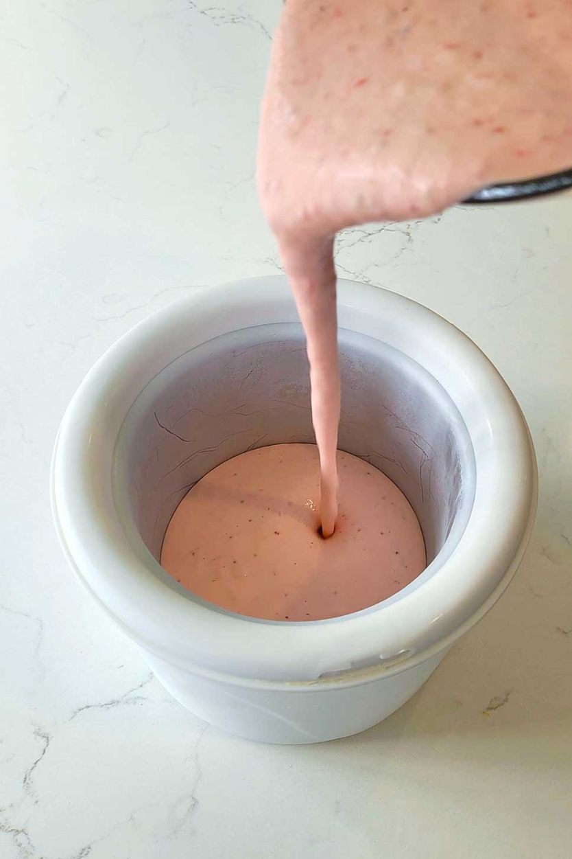 Pouring ice cream into the frozen ice cream maker bowl.